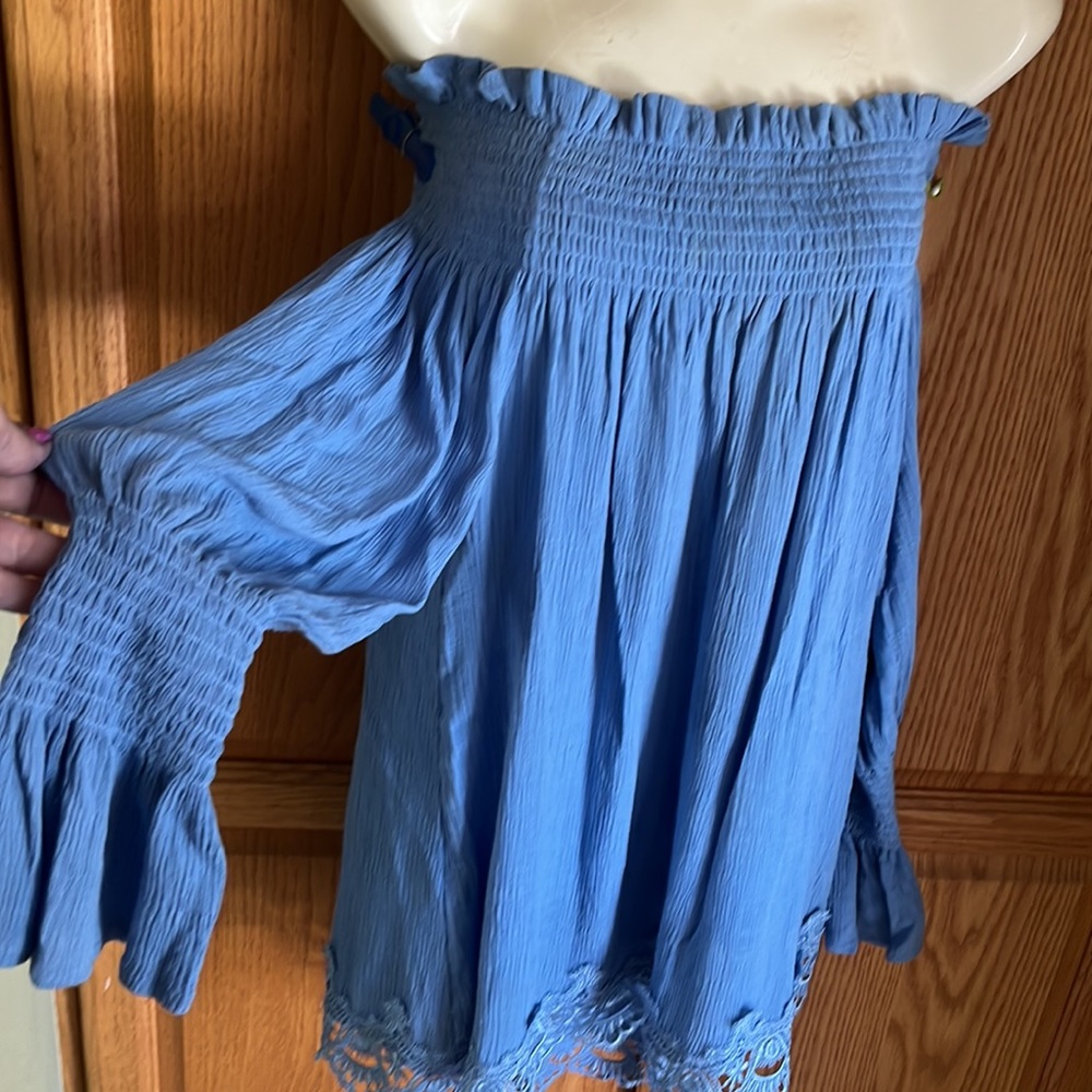 Cute Periwinkle blue cold off shoulder blouse. 100 rayon. Cute embroidered hem